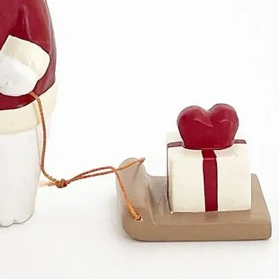 Wooden figurine – Polar bear Santa Claus with heart